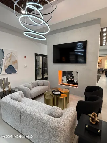 a room with furniture pool table and windows