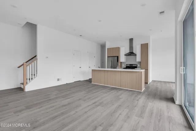 a view of kitchen with wooden floor