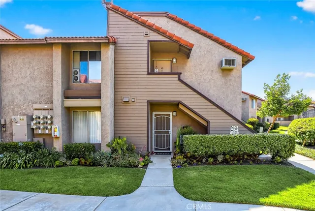 a front view of a house with garden