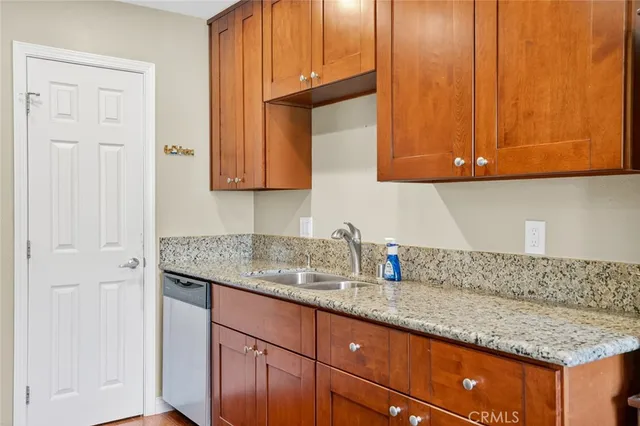 a kitchen with granite countertop cabinets and sink