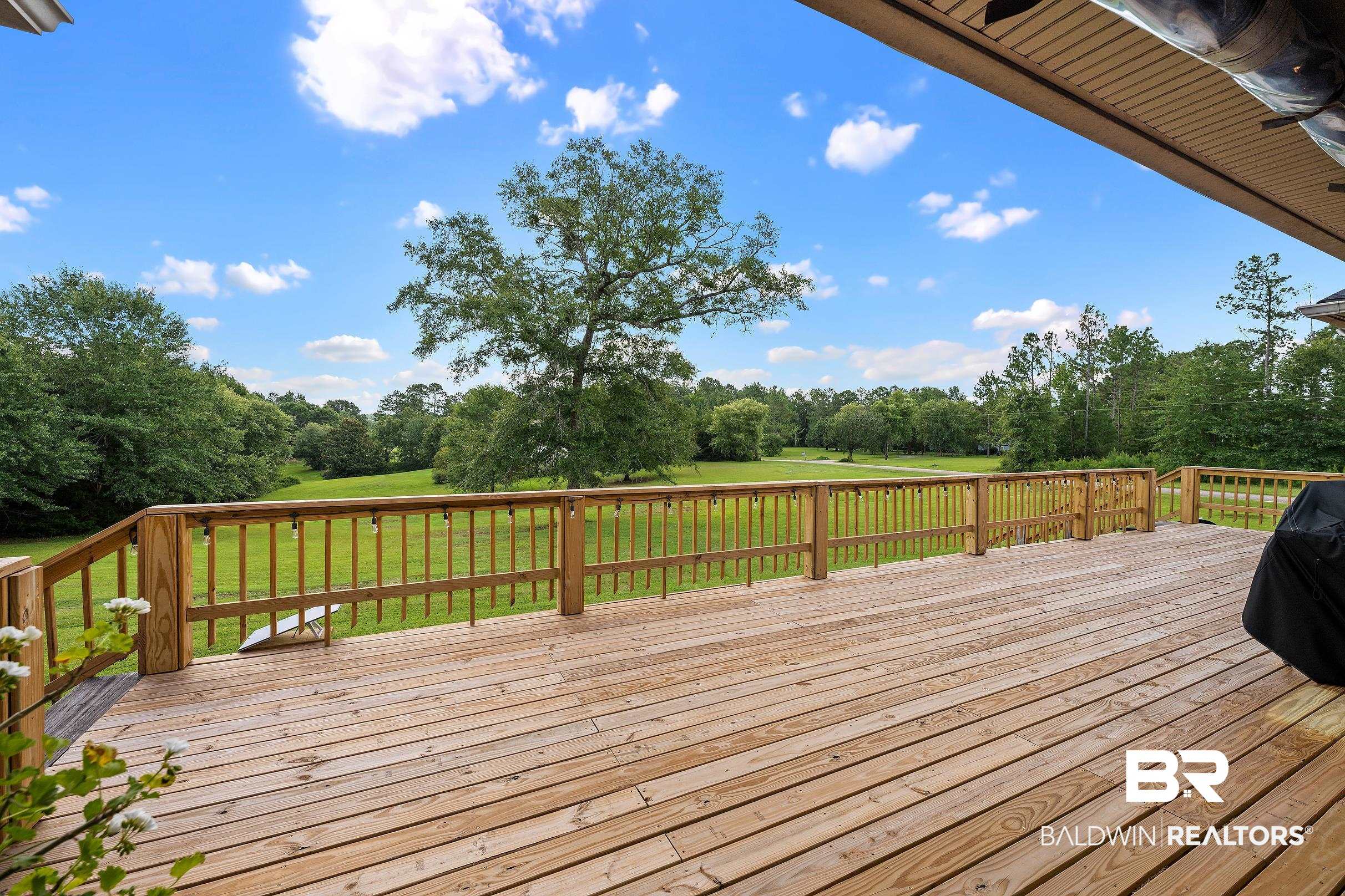 197 Morning Ridge Road Monroeville, AL 36460 - Photo 46 of 51 Expansive outdoor deck featuring natural wood decking and railings
