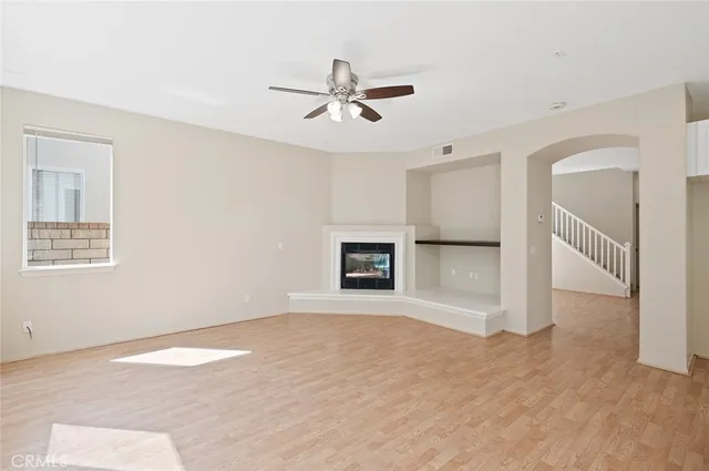 a view of kitchen with refrigerator and fireplace