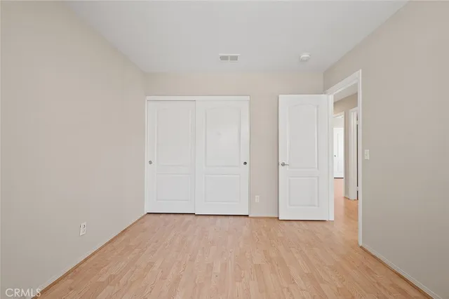 a bathroom with a sink mirror vanity and toilet