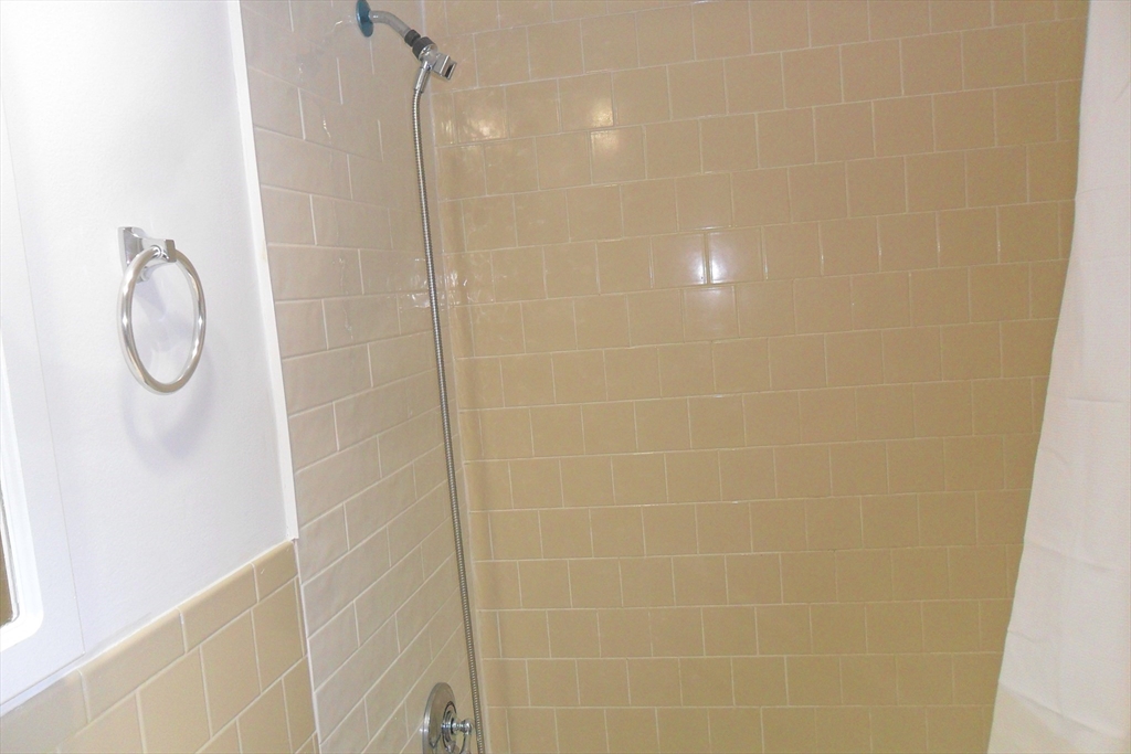 147 Turner Road, Unit 114 Holliston, MA 01746 - Photo 13 of 15 a bathroom with a shower