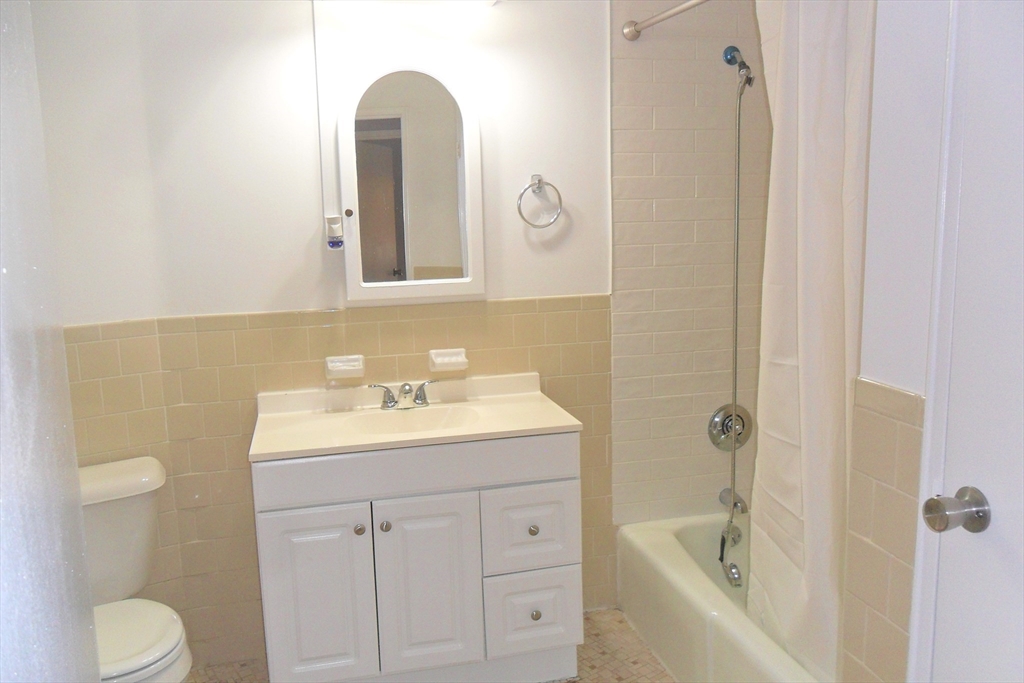 147 Turner Road, Unit 114 Holliston, MA 01746 - Photo 15 of 15 a bathroom with a sink toilet and shower