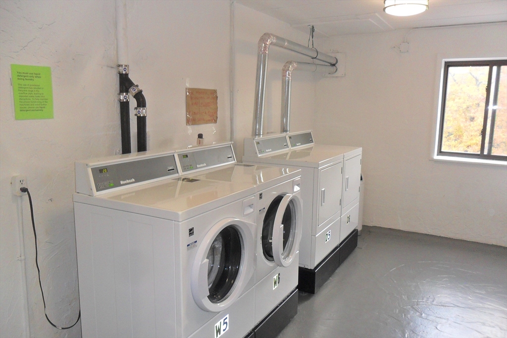 147 Turner Road, Unit 114 Holliston, MA 01746 - Photo 4 of 15 a utility room with dryer and washer