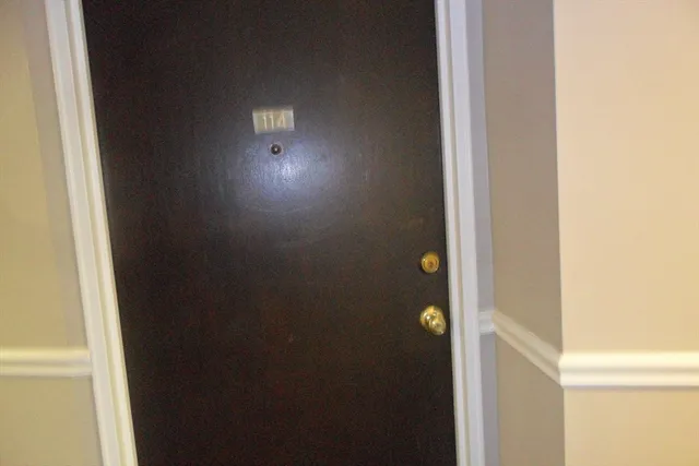 a kitchen with cabinets and white appliances