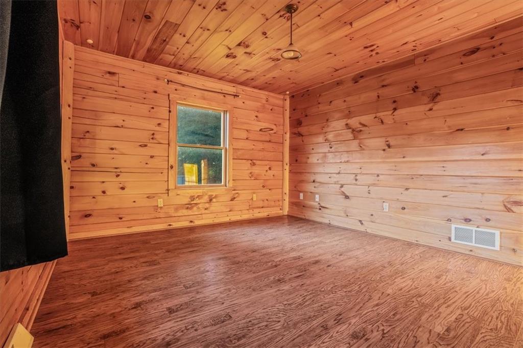 210 October Drive Butler, PA 16002 - Photo 25 of 36 a view of an empty room with wooden floor and a window