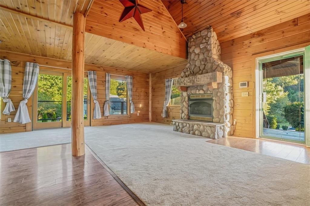 210 October Drive Butler, PA 16002 - Photo 9 of 36 a view of an empty room with wooden floor and a window