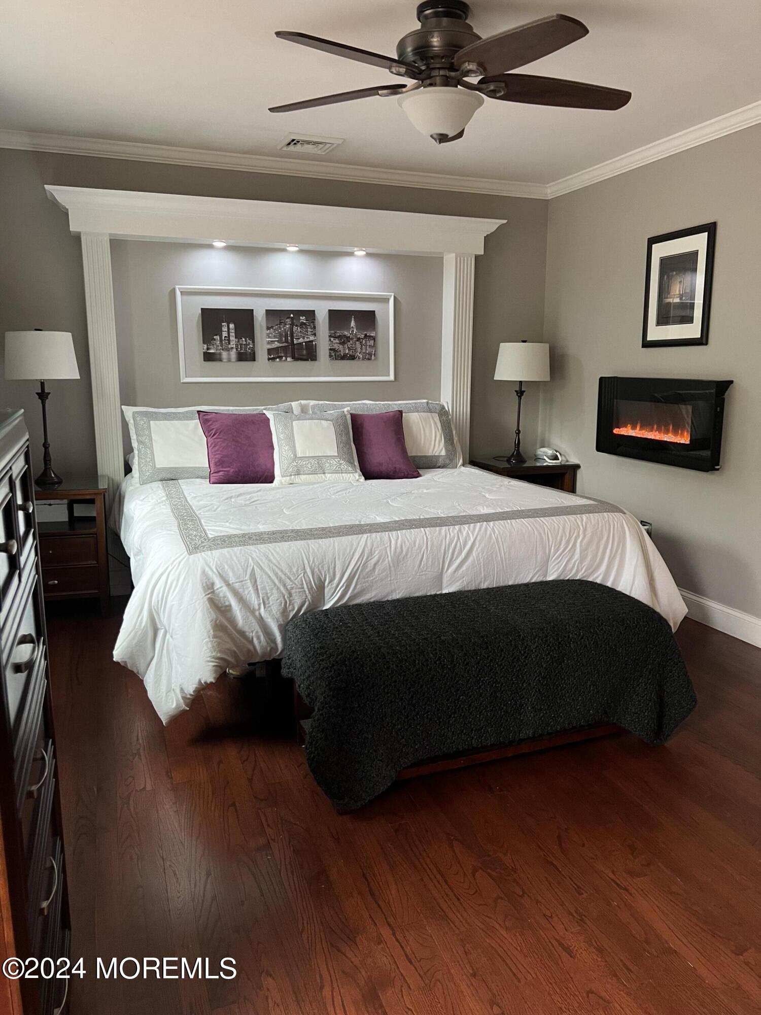 51 Lloyd Road Morganville, NJ 07751 - Photo 18 of 54 a bedroom with a large bed and a tv