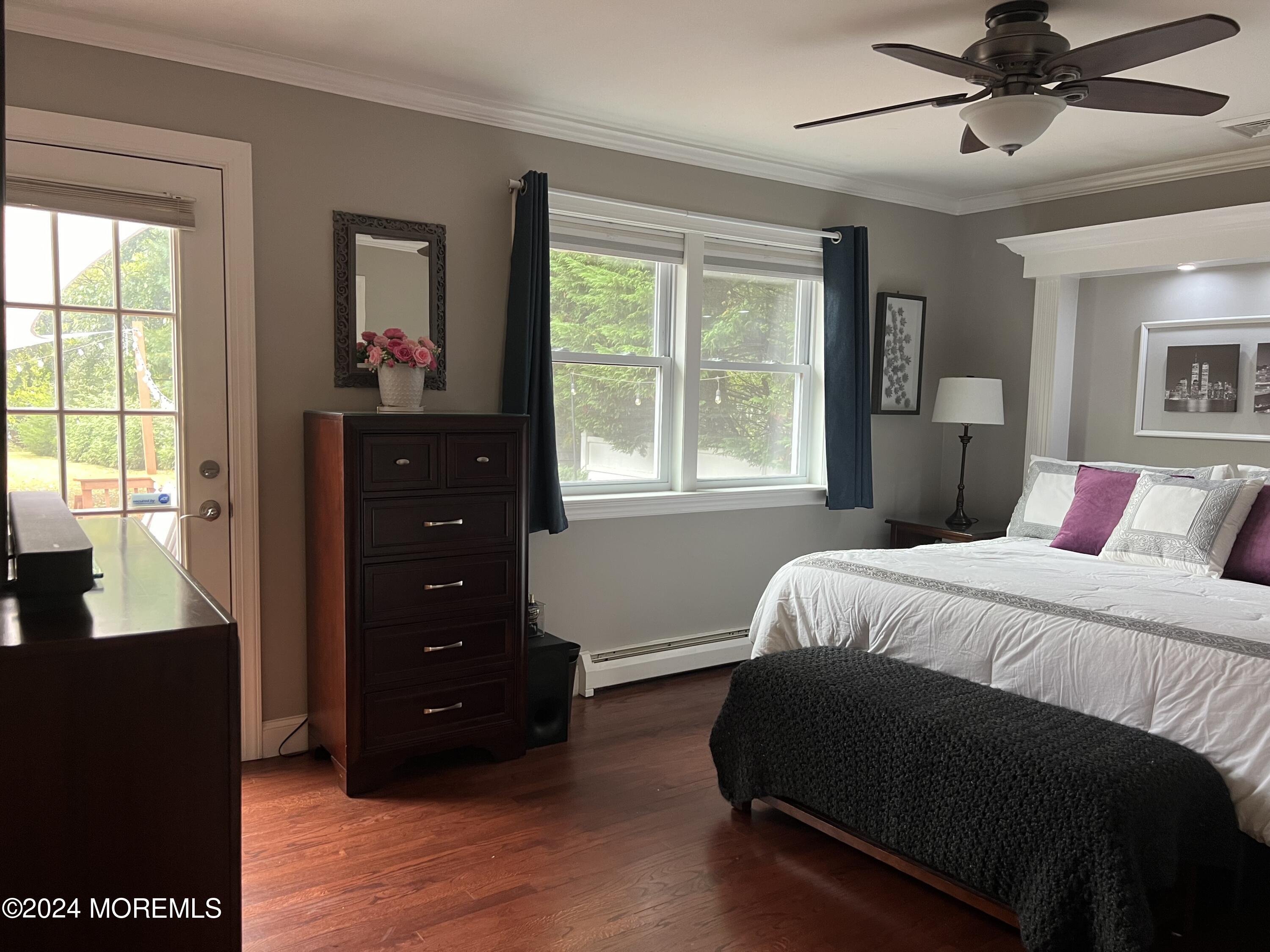 51 Lloyd Road Morganville, NJ 07751 - Photo 21 of 54 a bedroom with a bed and a window