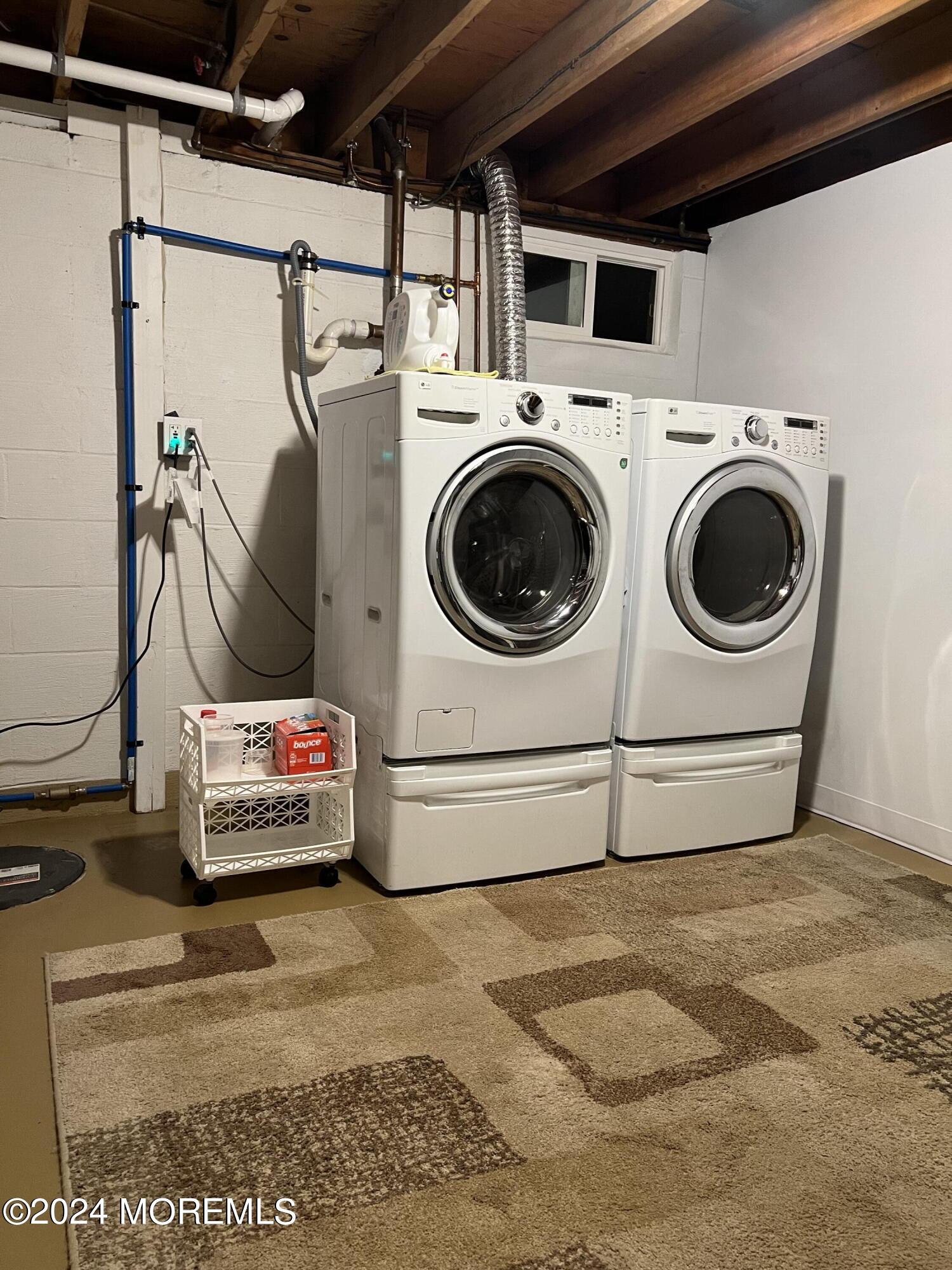 51 Lloyd Road Morganville, NJ 07751 - Photo 38 of 54 a utility room with dryer and washer