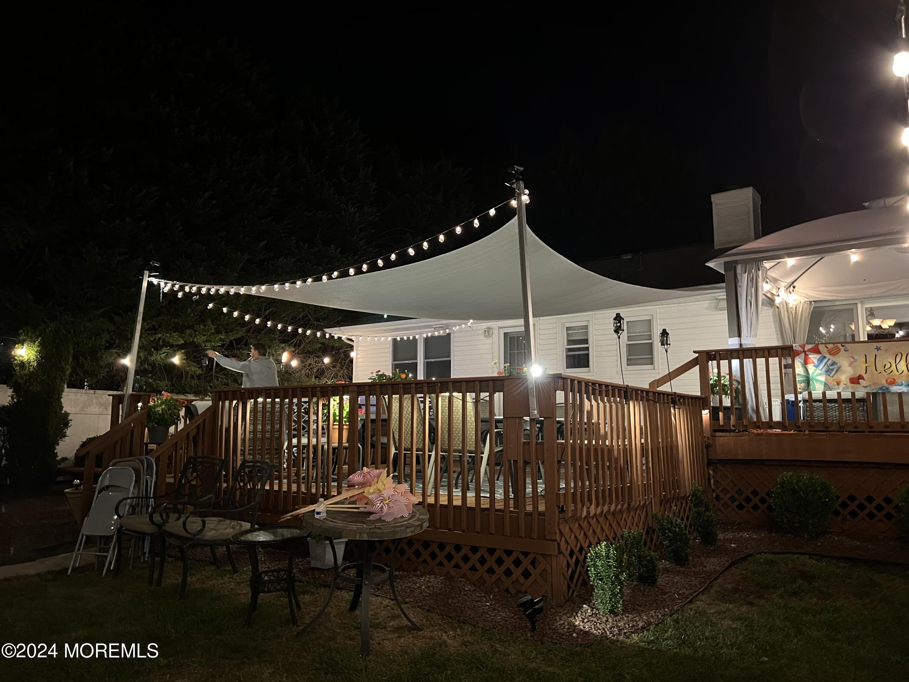 51 Lloyd Road Morganville, NJ 07751 - Photo 45 of 54 a roof deck with table and chairs
