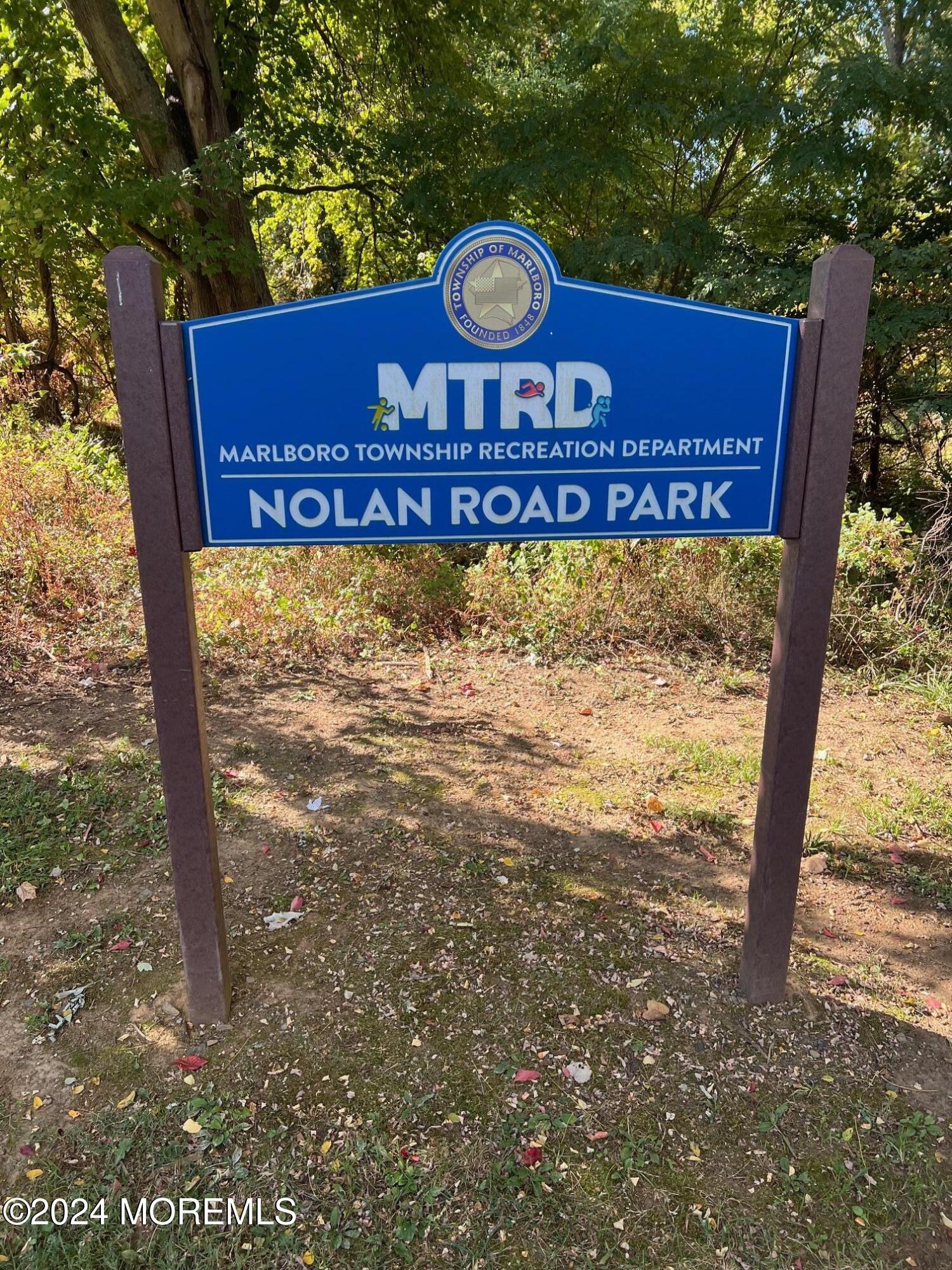 51 Lloyd Road Morganville, NJ 07751 - Photo 50 of 54 a sign on the side of a road