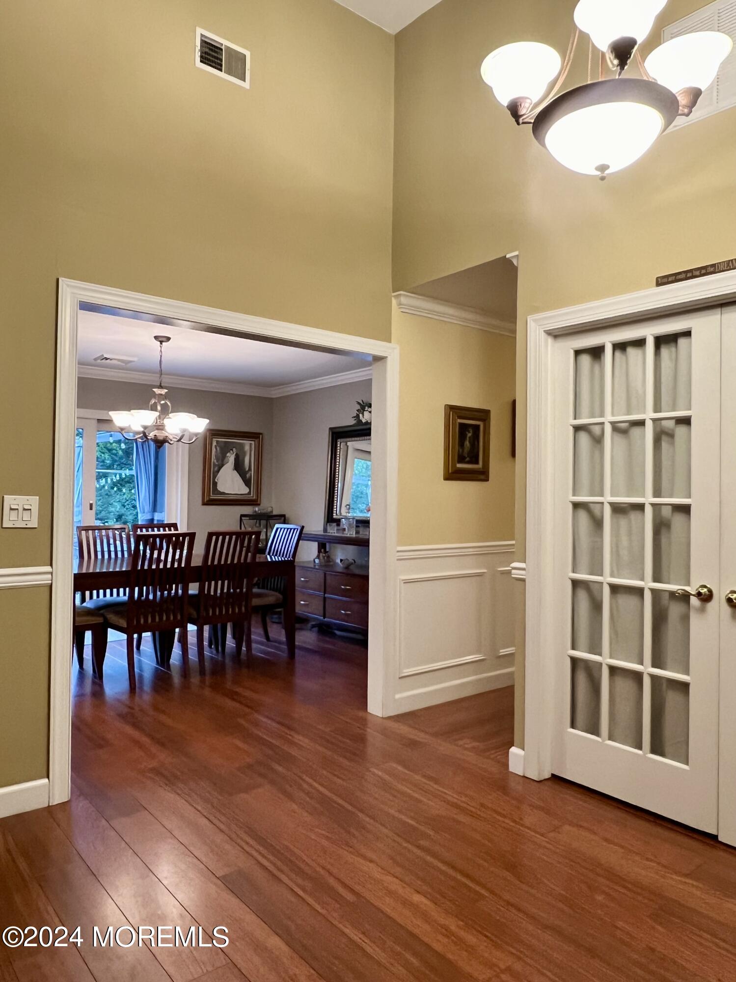 51 Lloyd Road Morganville, NJ 07751 - Photo 5 of 54 a view of dining room with furniture and wooden floor