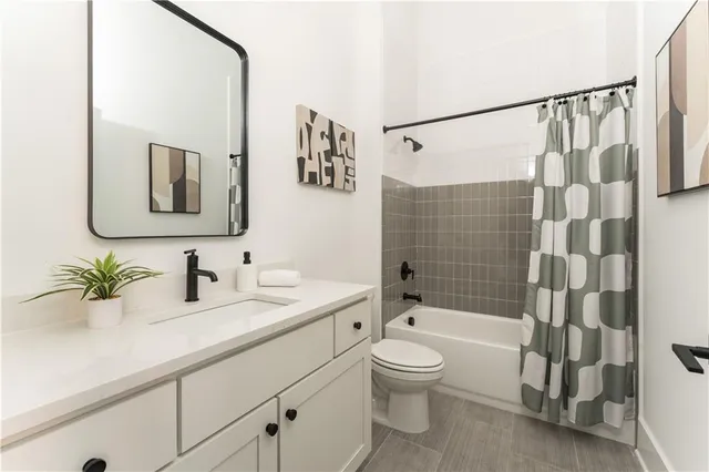 a view of a dining room with furniture and a chandelier
