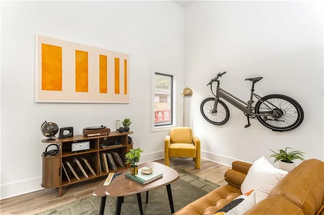 a view of a livingroom with furniture and a window