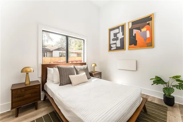 a bedroom with bed and window