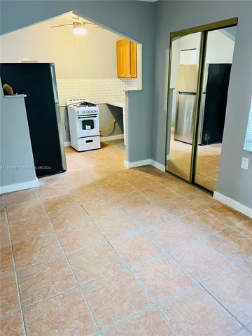 a view of an empty room with a fireplace