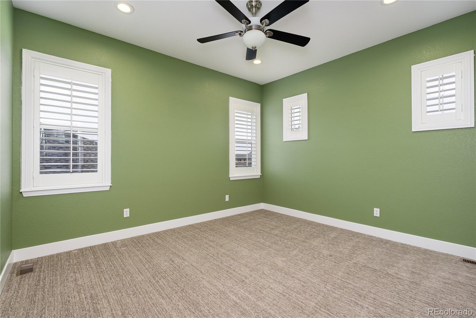 10960 Glengate Circle Highlands Ranch, CO 80130 - Photo 37 of 50 a view of room with window and ceiling fan