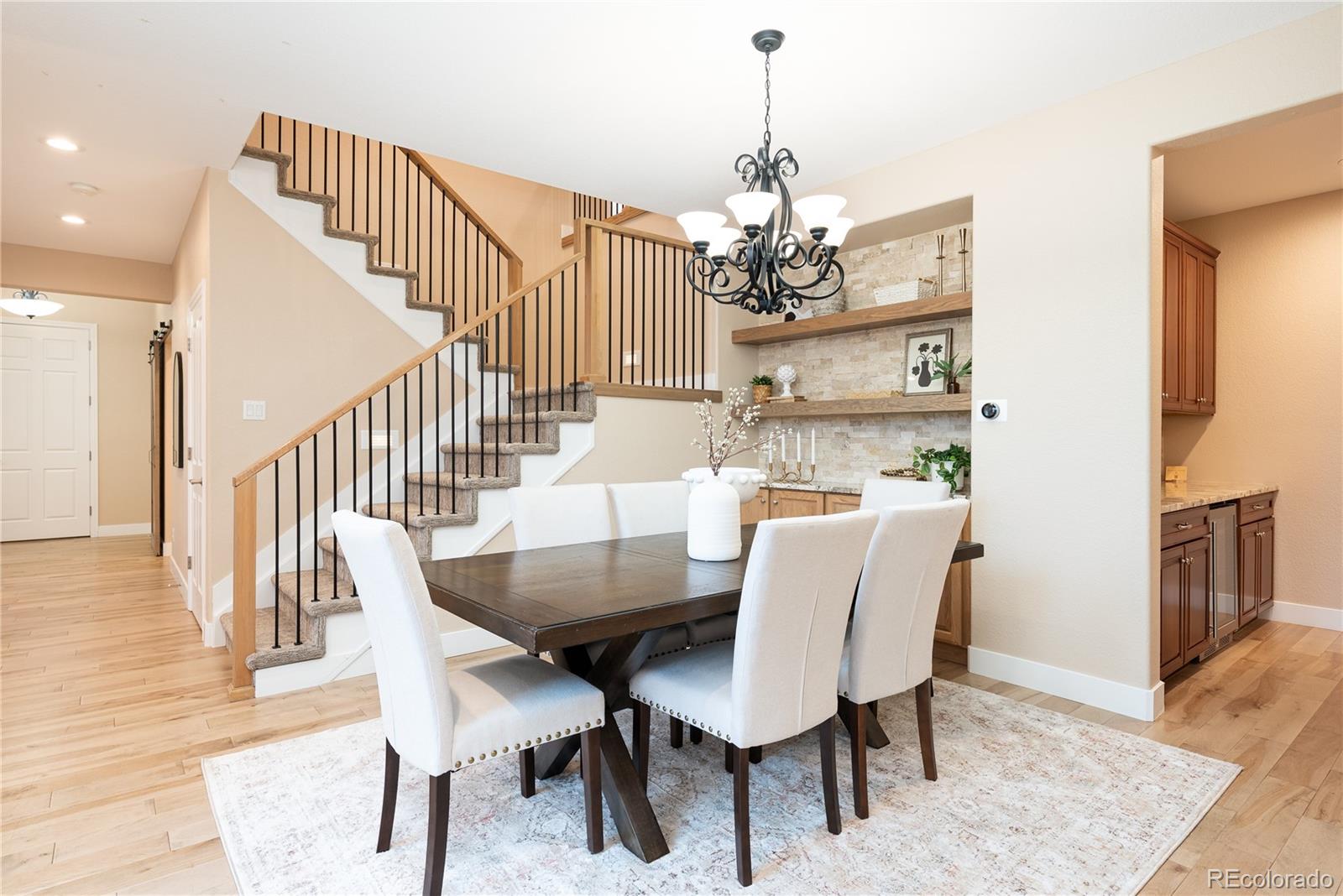 10960 Glengate Circle Highlands Ranch, CO 80130 - Photo 9 of 50 a view of a dining room with furniture
