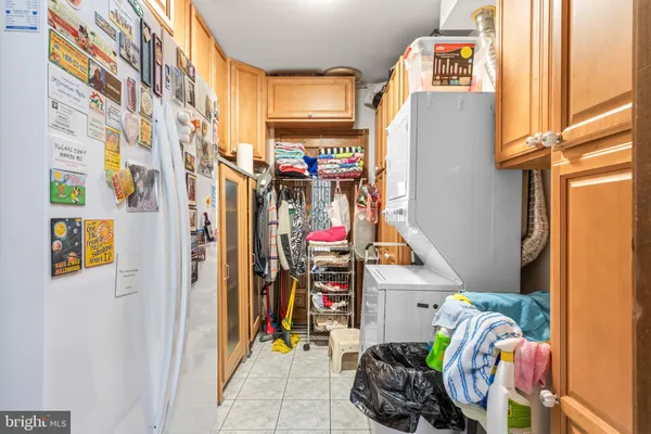 a view of a dining room with furniture a chandelier and wooden floor
