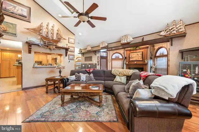 a view of a livingroom with furniture and a fireplace