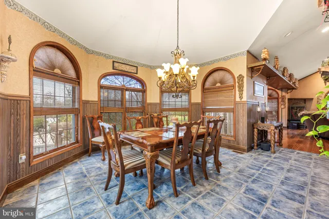 a bedroom with a bed and a table in it