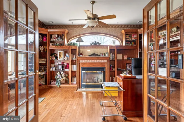 a spacious bathroom with a granite countertop sink mirror and a shower