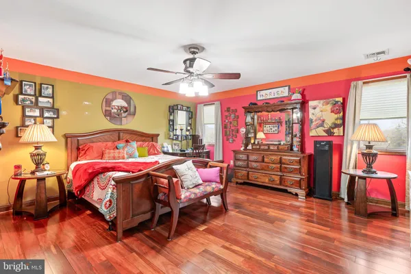 a room with stainless steel appliances kitchen island granite countertop a table and chairs in it