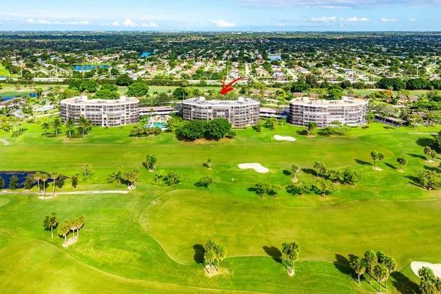 a view of a swimming pool with a yard