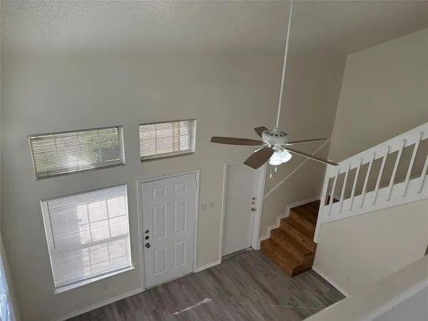 a view of entryway with wooden floor