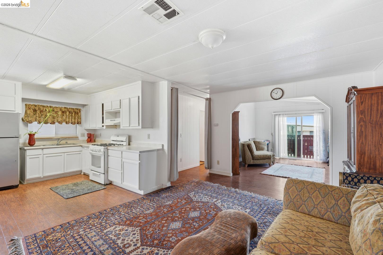 8200 Jantzen Road Modesto, CA 95357 - Photo 1 of 6 a living room with furniture and a open kitchen view