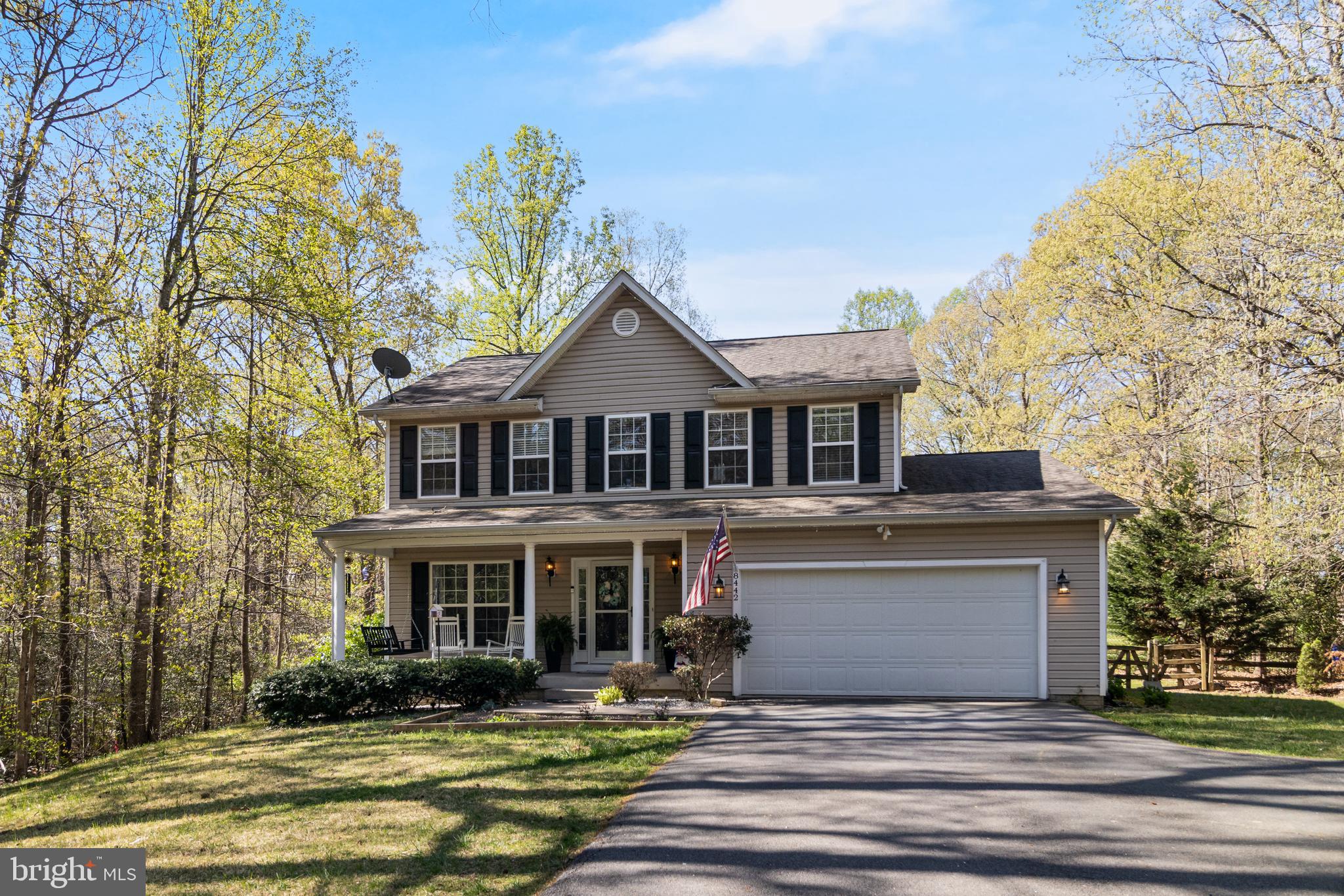 8442 Delegate Drive King George, VA 22485 - Photo 2 of 42 a front view of a house with garden