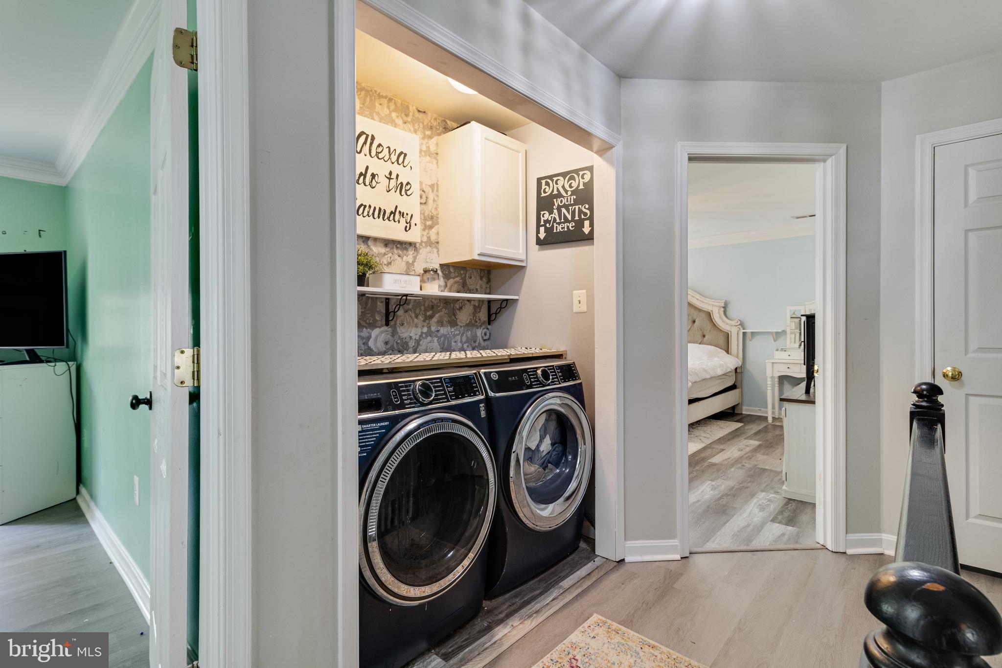 8442 Delegate Drive King George, VA 22485 - Photo 27 of 42 a view of a hallway with washer and dryer