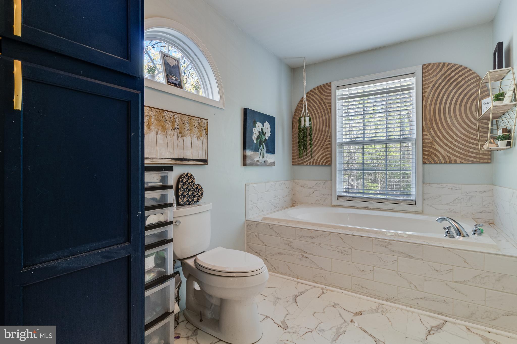 8442 Delegate Drive King George, VA 22485 - Photo 32 of 42 a bathroom with a toilet a sink and a bathtub