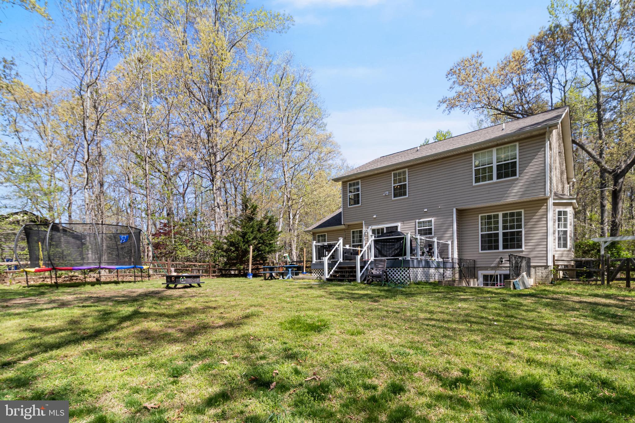 8442 Delegate Drive King George, VA 22485 - Photo 37 of 42 a view of a house with a big yard and large trees