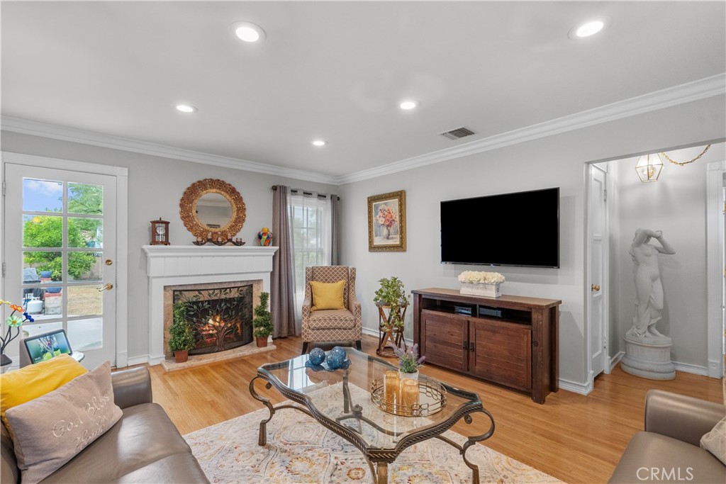 1902 North Screenland Drive Burbank, CA 91505 - Photo 11 of 25 a living room with furniture a flat screen tv and a fireplace