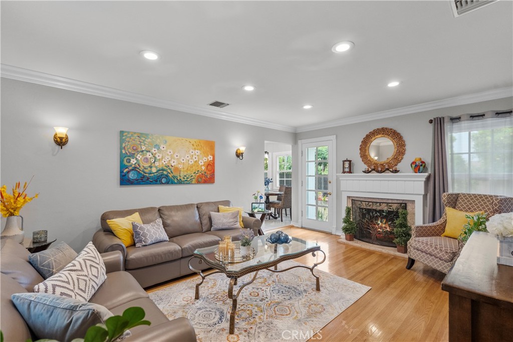 1902 North Screenland Drive Burbank, CA 91505 - Photo 12 of 25 a living room with furniture a fireplace and a potted plant