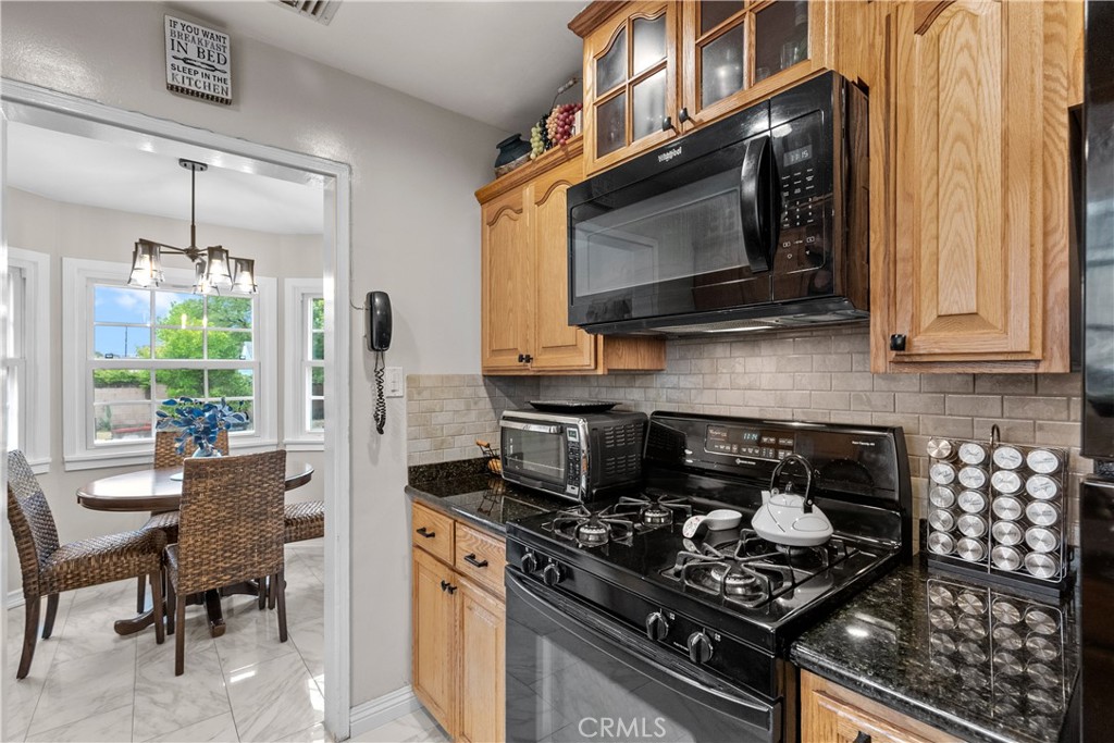 1902 North Screenland Drive Burbank, CA 91505 - Photo 19 of 25 a kitchen with a stove and a microwave