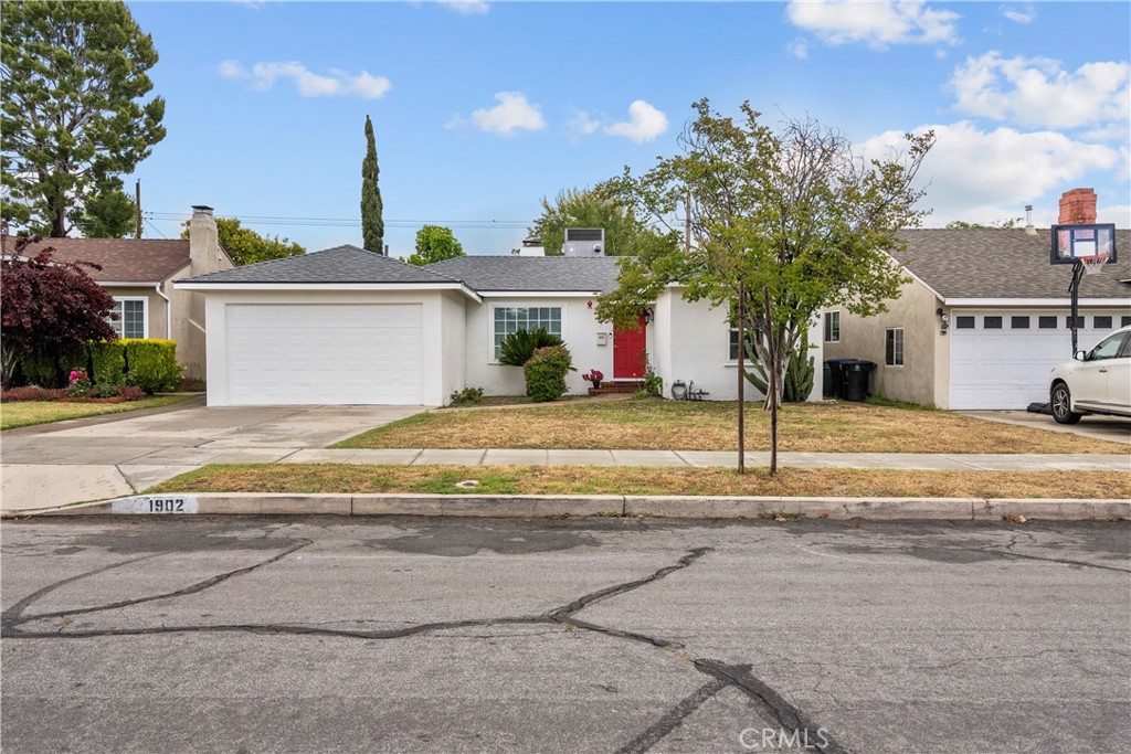 1902 North Screenland Drive Burbank, CA 91505 - Photo 3 of 25 a view of a house with a yard and palm trees