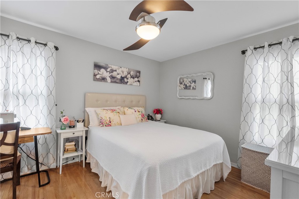 1902 North Screenland Drive Burbank, CA 91505 - Photo 10 of 25 a bedroom with a bed and a chandelier