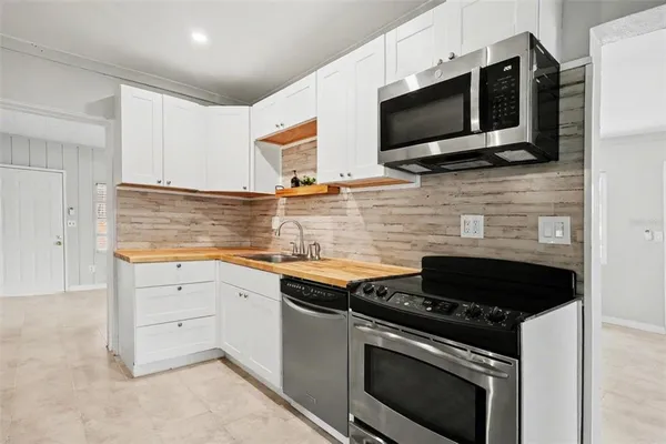 a kitchen with a stove and a microwave