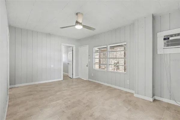 a view of an empty room with a window