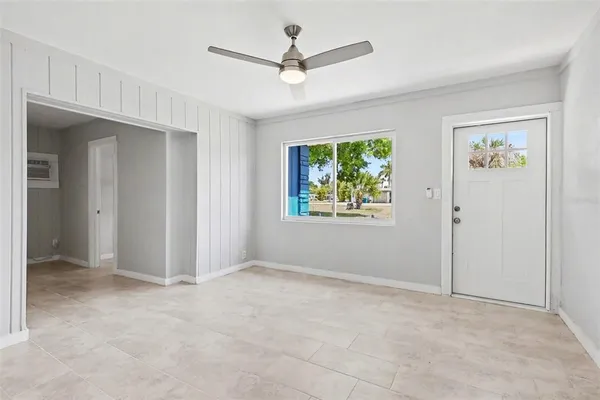 a view of an empty room with a window