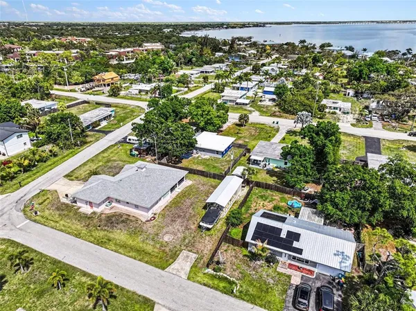 an aerial view of residential houses with outdoor space