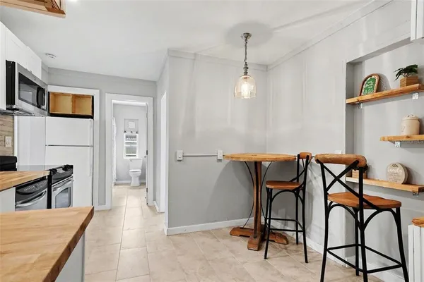 a view of a kitchen and dining room