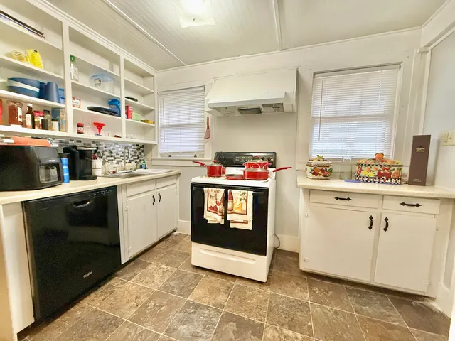 a view of an empty room with a bathroom