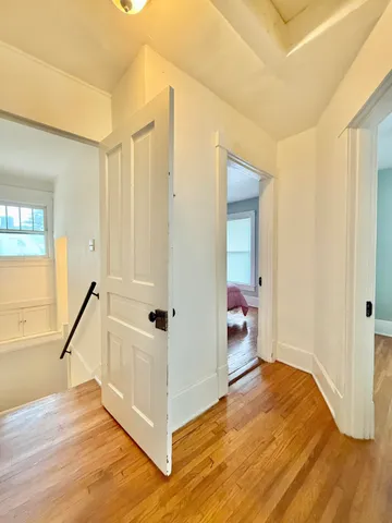 a view of a livingroom with furniture and staircase