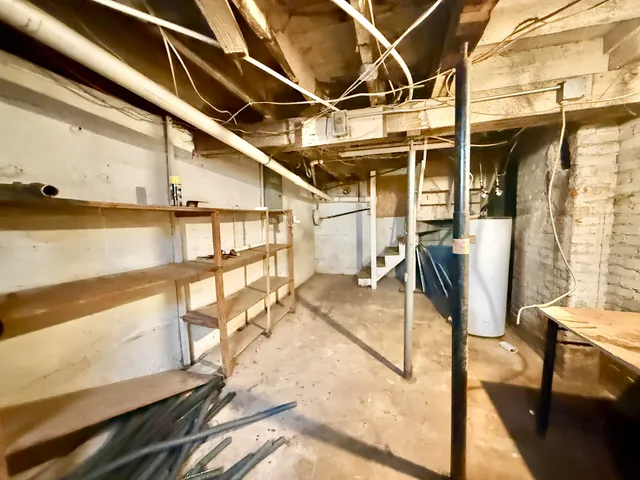 a group of chairs sitting in front of a house